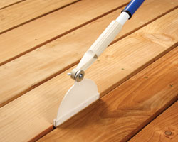Crack and Groove Tools paint and stain between deck and fence boards